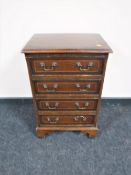 An inlaid mahogany Regency style four drawer chest
