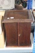 An Edwardian mahogany double door cabinet fitted four drawers