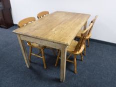 A pine farmhouse kitchen table and four chairs
