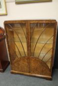 An Art Deco walnut display cabinet, width 91 cm. CONDITION REPORT: No signs of worm.
