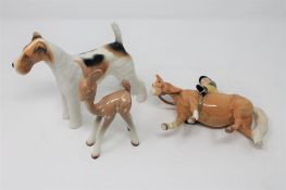 Three Beswick figures - Fawn, Airdale terrier and Thelwell series boy on pony (a/f).