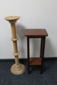 A pine twist column torchere together with a mahogany two tier plant stand