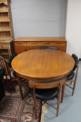 A six piece teak G-plan dining room suite comprising of sideboard,
