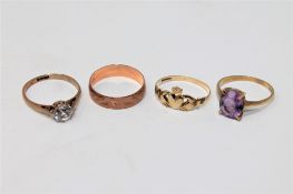 Four 9ct gold rings to include a solitaire, amethyst, Claddagh and band example.