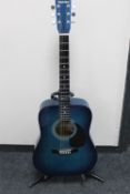 A Westville acoustic guitar on stand