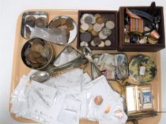 A tray containing pre-decimal British coinage, teaspoons, medals, watches, costume jewellery,