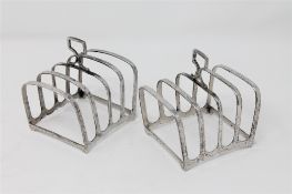 A pair of silver toast racks CONDITION REPORT: Toast racks are 8cm long.