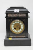 A Victorian slate and marble mantle clock with pendulum and key