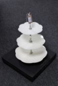 A boxed culinary concept three tier cake stand