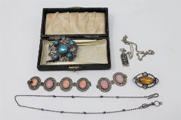 A Charles Horner Arts and Crafts style brooch set with yellow stone,