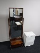 A mid twentieth century cheval mirror together with a loom linen basket