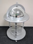 A contemporary glitter ball drinks trolley