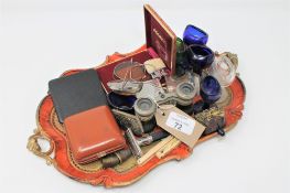 An interesting collection of antique glass eye baths, Ronson lighter, opera spectacles,