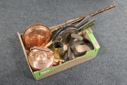 A box of antique brass and copper kettle, bed pan, flat irons, embossed bellows,