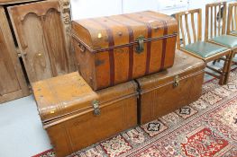 Three vintage tin trunks