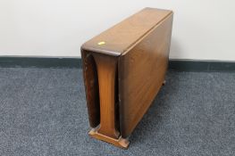 An Ercol elm drop leaf coffee table