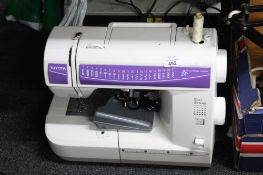 A Toyota electric sewing machine with foot pedal