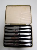 A cased set of six silver handled butter knives