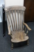 A late 19th century farmhouse kitchen armchair