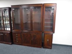 An inlaid mahogany triple section corner bookcase