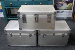Three aluminium flight cases.