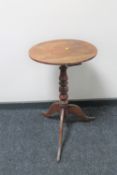 A Victorian mahogany pedestal wine table