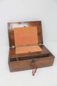 An antique walnut fitted writing box