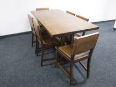 An oak refectory dining table with six chairs