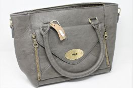 A leather Mulberry handbag with dust cover