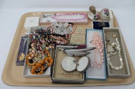 A collection of costume jewellery, atomiser, beads and necklaces etc,