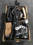 A box of cameras and accessories,