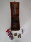 A cigar box containing a WWI medal named to 148595 Cpl S. Garratt 78 - Can. Inf.