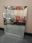 A glass framed mirror