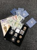 A collection of coins and bank notes to include Ten Shillings, One pound, half dollars,