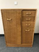 A mid 20th century oak G Plan linen chest and a walnut four drawer chest