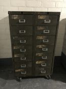 A mid 20th century industrial metal 14 drawer chest on wheels CONDITION REPORT: