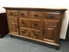 A late Victorian walnut sideboard,