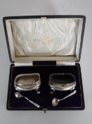 A pair of cased silver salts with spoons