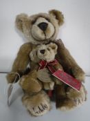 An Aurora Millenium bear with cub.