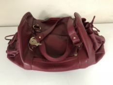 A lady's Burgundy leather handbag containing silk scarves CONDITION REPORT: The