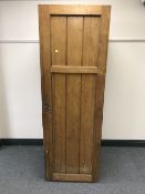 A Victorian pine single door wardrobe fitted three drawers and trays
