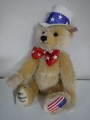 A Steiff blond mohair bear - First American Teddy, length 42 cm.