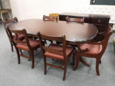 An inlaid twin pedestal table with leaf and six dining chairs