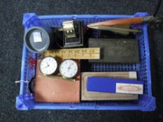 A basket of collectable's, perpetual calendar, chess pieces, trench art,