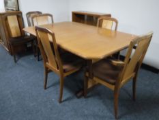A teak G Plan extending table with leaf and six chairs