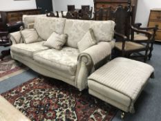 A contemporary three piece lounge suite comprising of three seater settee,
