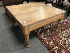 An antique pine low table,