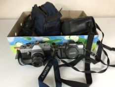 A box of cameras, camera bags and accessories,