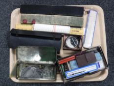 A tray of rulers, slide rule, drawing instruments, cased over-beck rejuvenator,