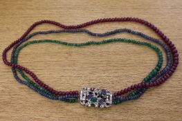 A very fine quality tutti-fruiti necklace comprising three strands of ruby,